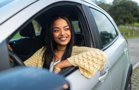 Woman drives off in a new car