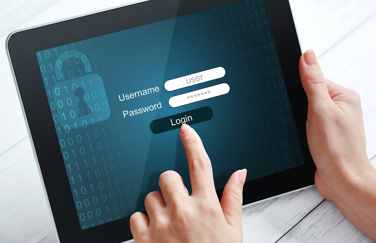 close up of username and password login screen of ipad that woman holds