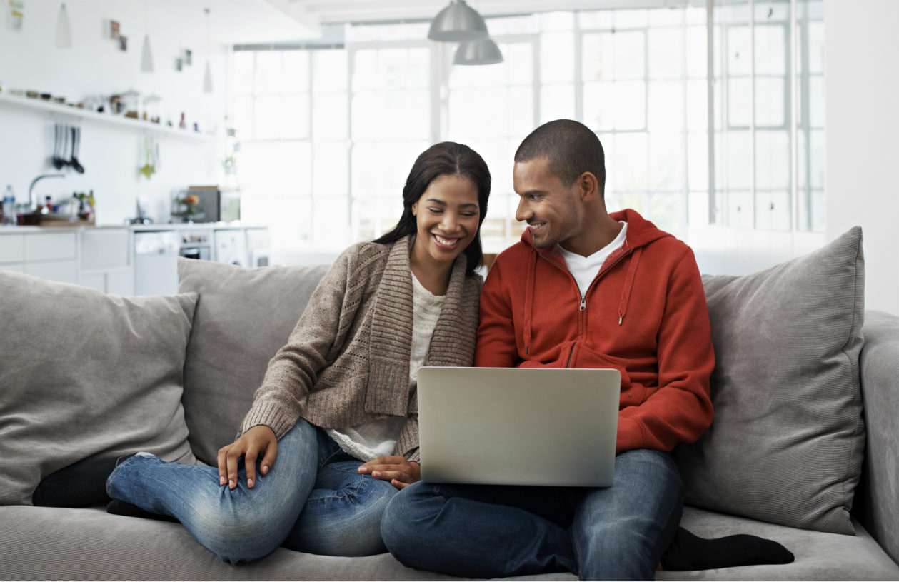 couple looking for home on computer